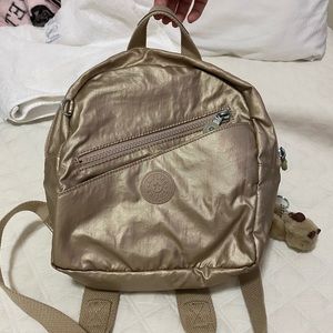 Kipling gold mini backpack